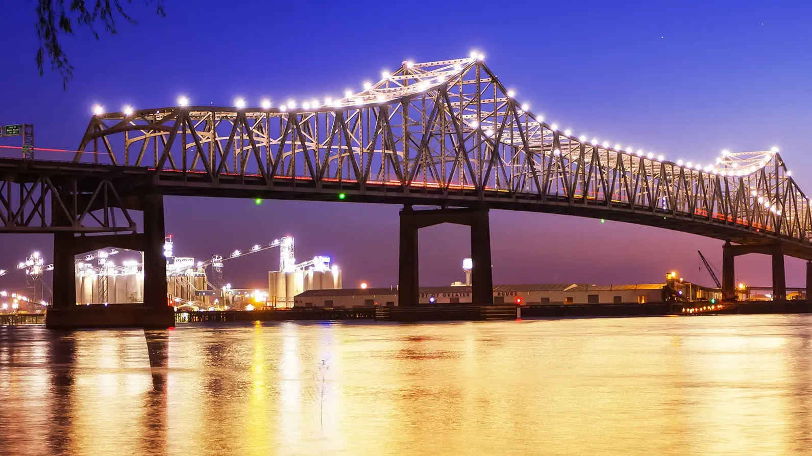 Horace Wilkinson Bridge crosses over the Mississippi River at night in Baton Rouge, Louisiana
